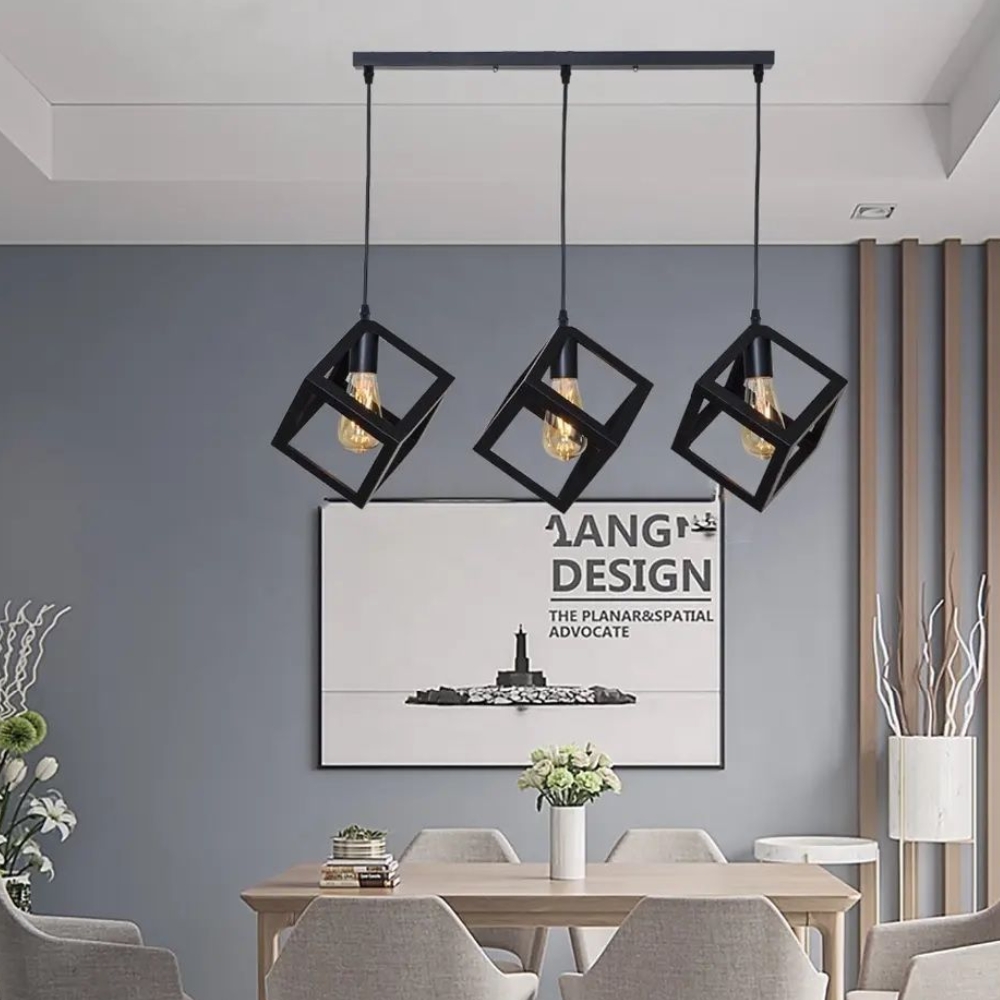 Black cube pendant lamp above a modern dining area