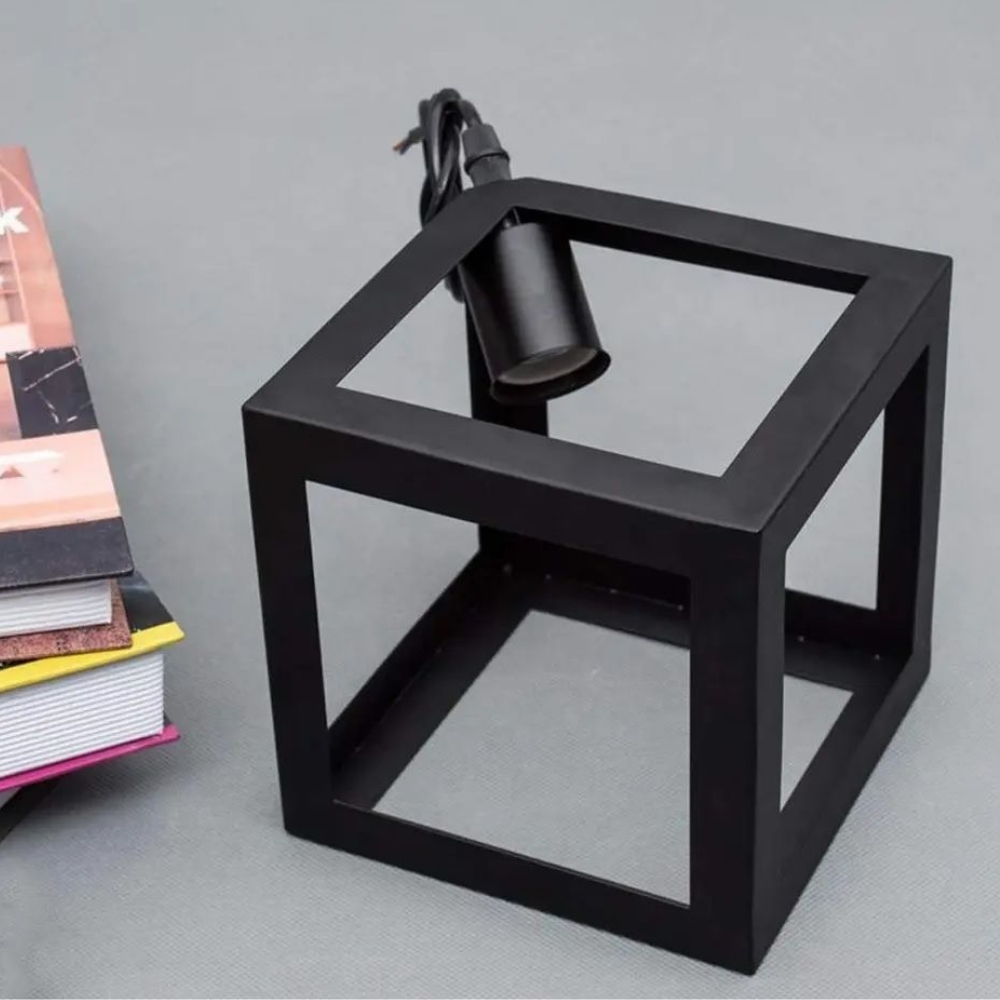 Close-up of black geometric cube pendant lamp fixture