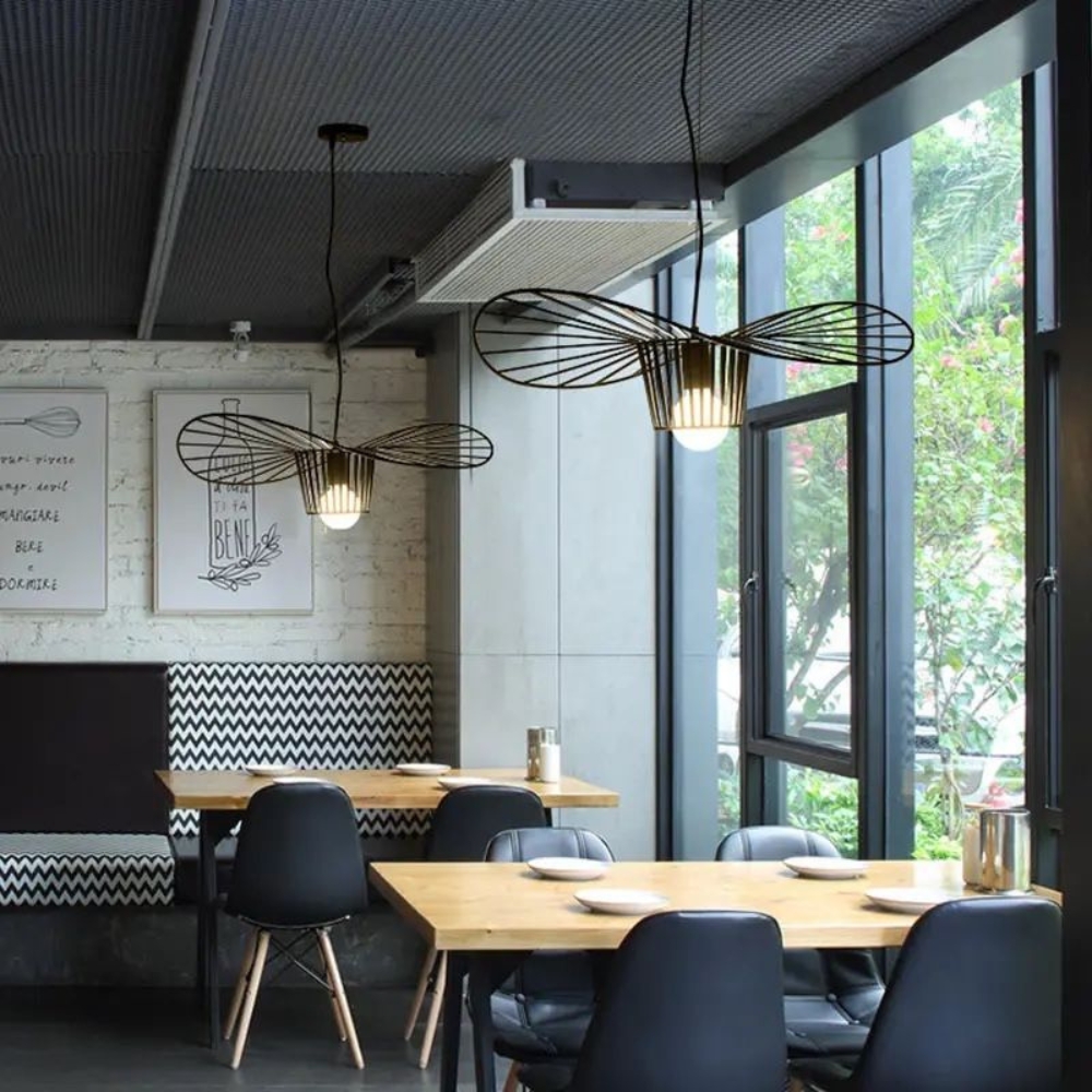 Pendant lamp lighting a stylish café interior with wooden accents